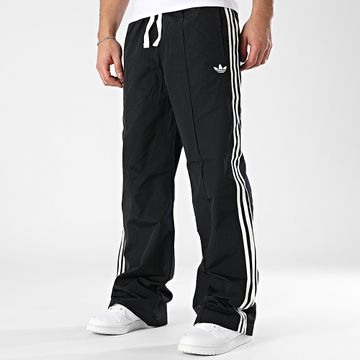 Adidas Originals - Pantaloni da jogging con bande nere Baggy Fit Woven Q1 JM1785