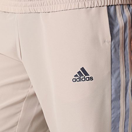 Adidas Sportswear - Tuta da ginnastica a righe IC6780 Beige Azzurro